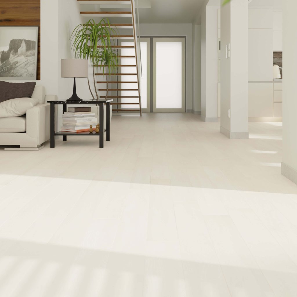 Modern living room with Paris Oak flooring, a beige sofa, black side table with lamp and plant, floating wooden staircase, and glass double doors at the back allowing natural light in.