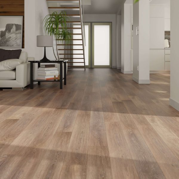 A modern living space featuring Sydney Oak* wood flooring, a white sofa, side table with plant, open staircase, and double doors to a bright entryway. Minimalist decor and abundant natural light complete the look.