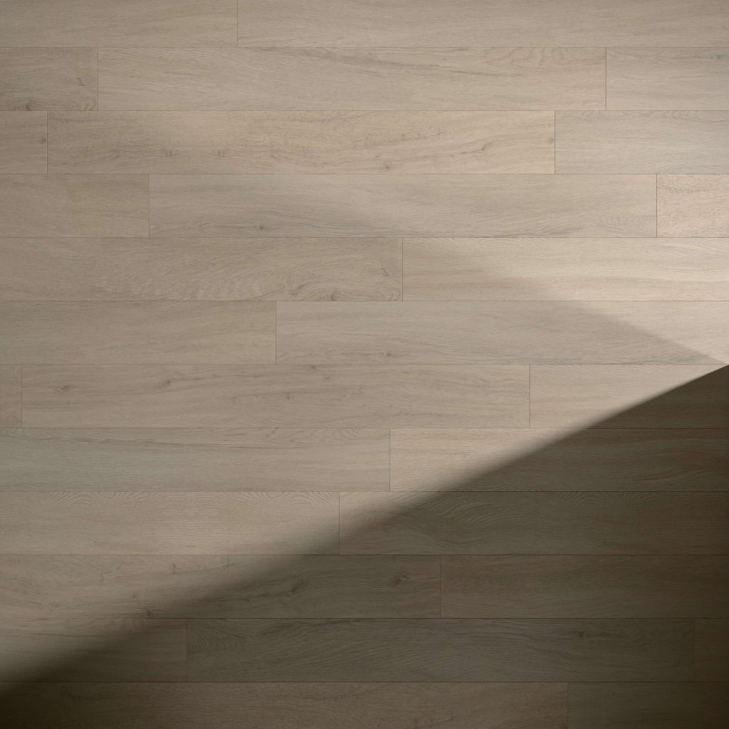 Athens Oak floorboards in a light wood tone, featuring a soft diagonal shadow across the bottom right corner that highlights the contrast between illuminated and shaded sections.