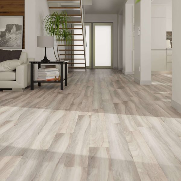 Modern living space featuring Rio Walnut flooring, a white sofa, black side table with lamp and plant, open staircase, glass double doors at the back, and a visible kitchen area to the right.
