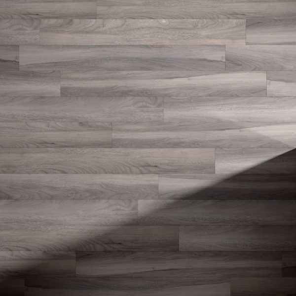 The Rio Walnut* floor features gray horizontal planks with a diagonal shadow in the lower right corner, and lighting that accentuates its natural wood grain and texture.