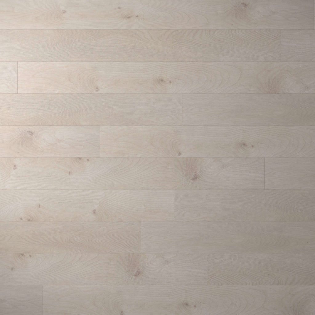 Agassi* features a light-colored wooden floor with a subtle grain pattern. Evenly aligned horizontal planks and a natural, pale finish create a seamless, clean look.