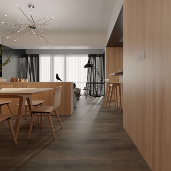 A modern, minimalist dining and living area featuring Nadal*—light wood furniture, dark wood floors, a round table with chairs, a starburst ceiling light, large windows with sheer curtains, and a decorative black bird statue.