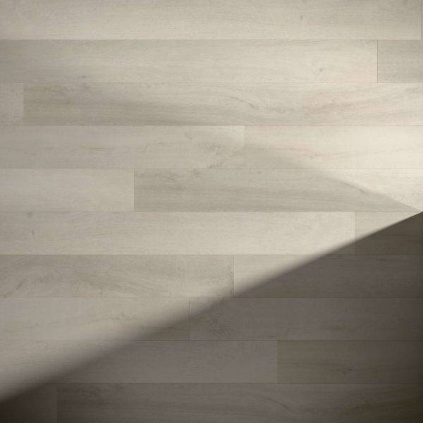 Badosa* features light-colored wood planks arranged horizontally, with a diagonal shadow across the lower right, highlighting the contrast between shaded and well-lit areas.