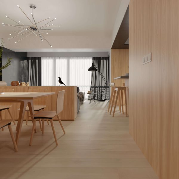A modern, minimalist living and dining area features the Martina collection’s light wood furniture, neutral tones, large windows with sheer curtains, a decorative black bird, and a striking starburst chandelier.