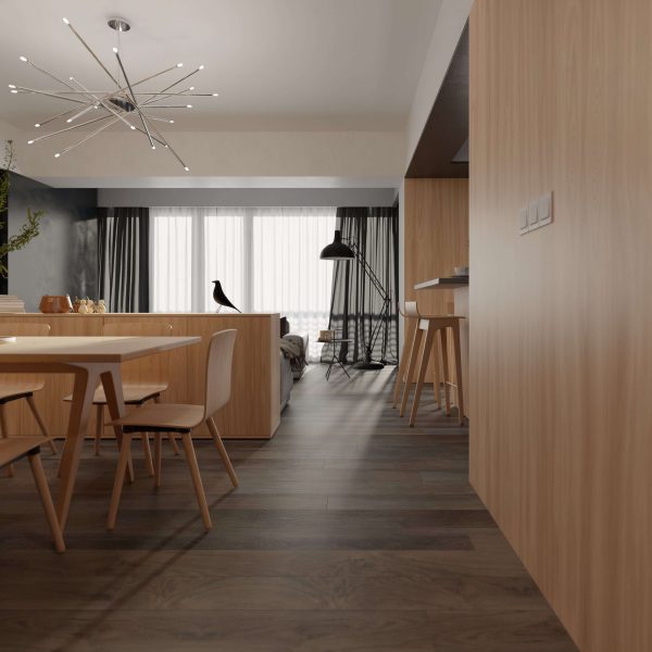 The Osaka features a modern open-plan living and dining area with light wood furniture, dark wood floors, a starburst ceiling light, large windows with sheer curtains, and a black bird sculpture on the table.