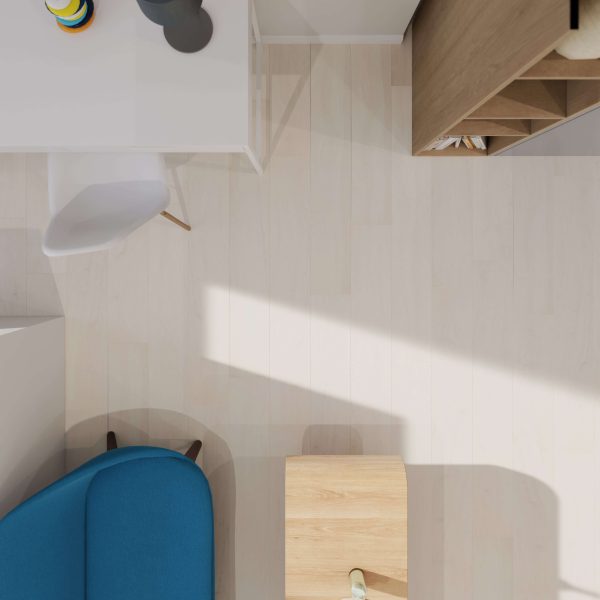 A top-down view of a modern room with a blue chair, white desk and lamp, white chair, and light wood shelving unit. Sunlight casts shadows across the Paris Oak floor.