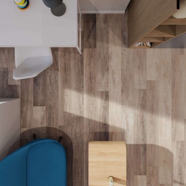 A top-down view of a modern interior corner featuring a white desk, white chair, blue sofa, wooden shelves, and Tokyo Oak* flooring. Sunlight casts soft shadows across the floor.