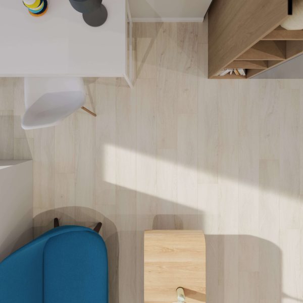 Top-down view of a modern, minimalistic room featuring London Oak light wooden flooring, a white desk and chair, blue armchair, small wooden table, and part of a bookshelf. Sunlight casts soft shadows across the London Oak floor.