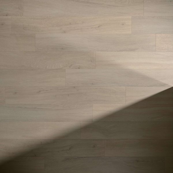 Athens Oak floorboards feature a light color and natural grain, partially covered by a diagonal shadow from the lower left corner, creating striking contrast between illuminated and shaded areas.