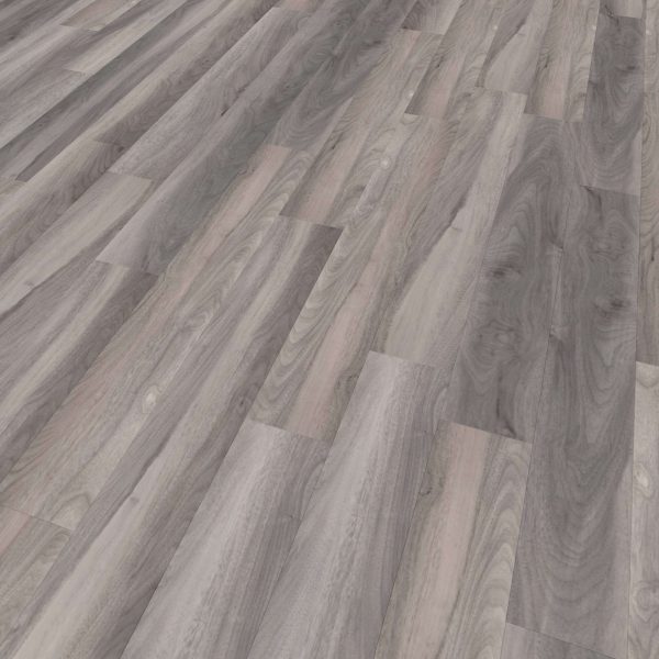 A close-up of Rio Walnut* flooring showcases wide planks in grey tones with subtle pink and brown hues, highlighting natural wood grain and knots.
