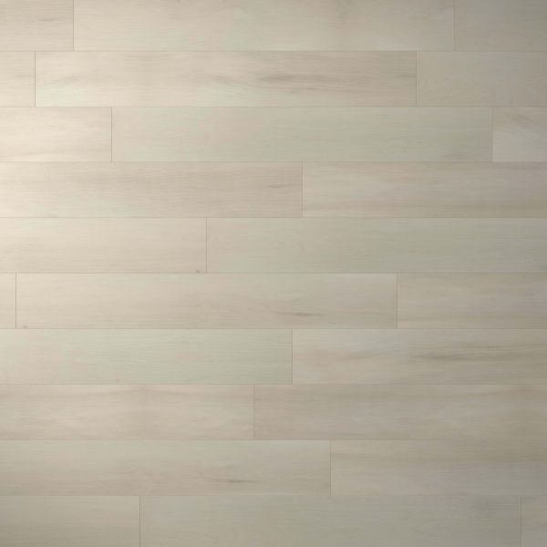 Sittler features light-colored wooden floor planks arranged horizontally, showcasing subtle variations in tone and grain for a soft, natural look.