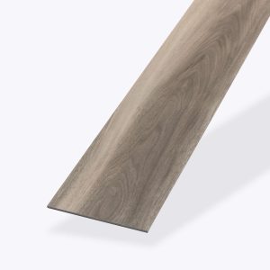 A single plank of Rio Walnut* vinyl flooring, featuring light brown tones and natural grain patterns, displayed at an angle on a plain white background.