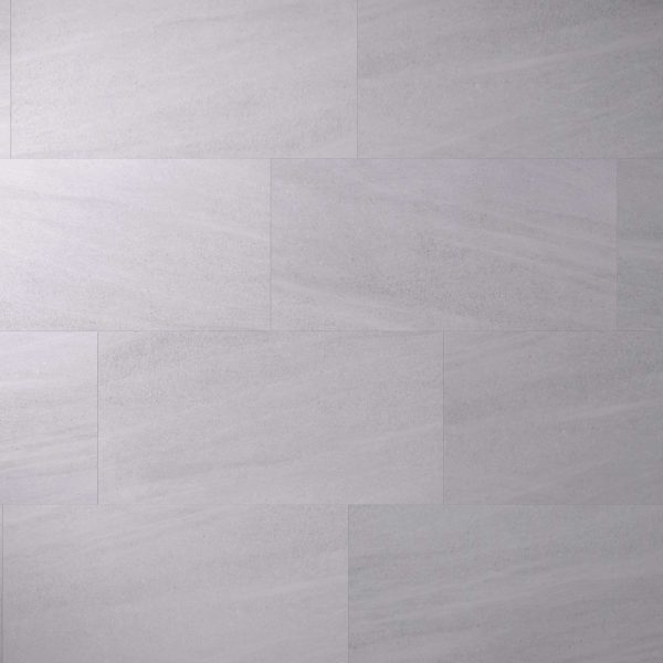 Tidal Grey* tiles feature a light gray color and rectangular shape, arranged in a staggered pattern for a smooth, uniform surface with subtle shading and texture variations.