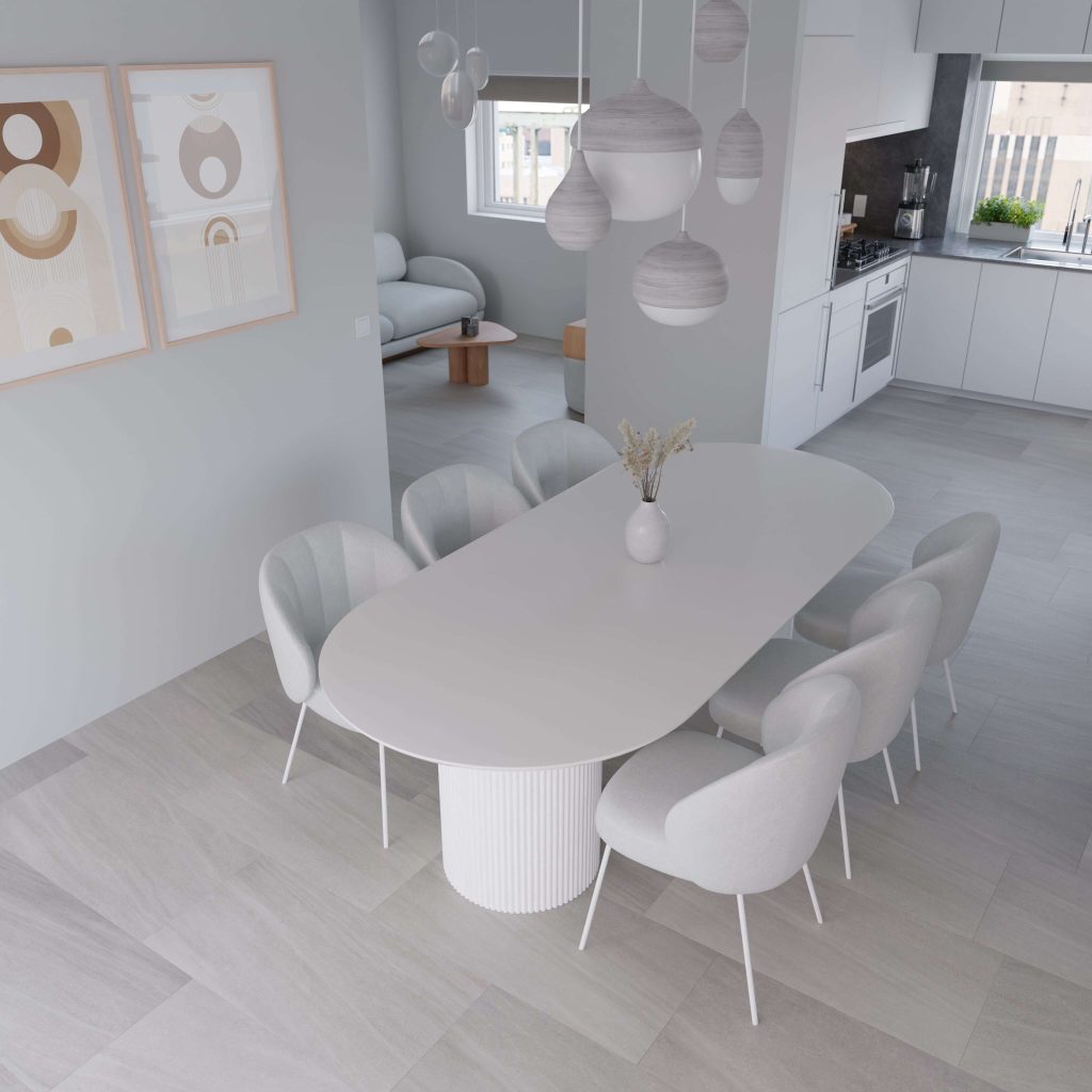 A modern dining area features an Allure Beige* oval table, eight white chairs, and pendant lights. Minimalist decor includes abstract art and a vase with dried flowers. The open-plan space connects to the kitchen and living area.