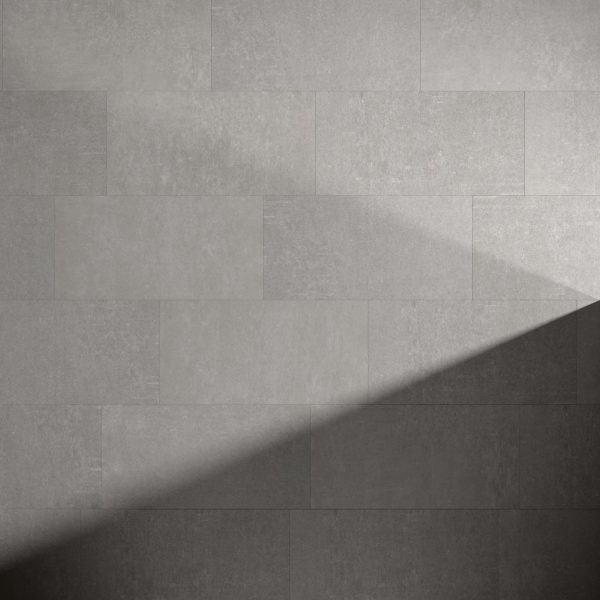 A Metro Grey* tiled wall with a diagonal shadow across the lower right, highlighting a contrast between light and dark areas.