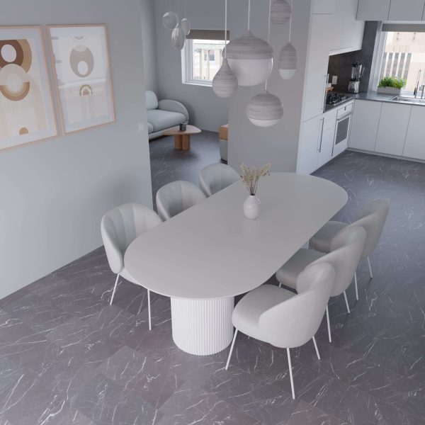 The Nero dining room features a white oval table, six cushioned chairs, pendant lights, minimalist wall art, and an open layout connecting to the kitchen and living area with large windows.