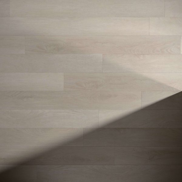 Lasalle light wood floor panels feature a subtle wood grain pattern. A diagonal shadow in the lower right corner highlights the contrast between illuminated and shaded areas of the floor.