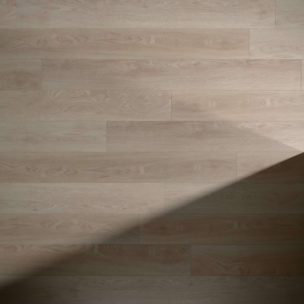 Merle light brown wooden floor planks feature a diagonal shadow across the lower right corner, highlighting the contrast between illuminated and shaded areas.