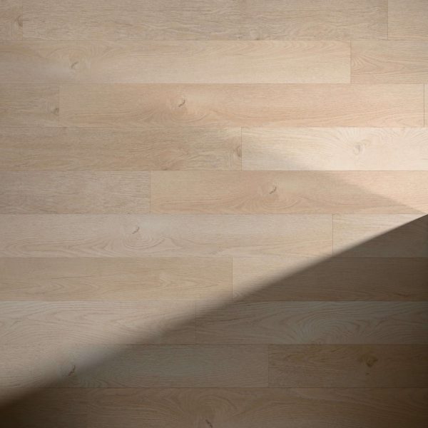 Marshland light wood flooring features a subtle diagonal shadow that highlights its natural grain and textured surface.