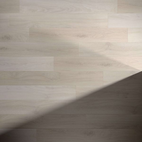 Eden light wood flooring features subtle grain patterns and a smooth surface, highlighted by a diagonal shadow in the lower right corner that contrasts the illuminated and shaded areas.