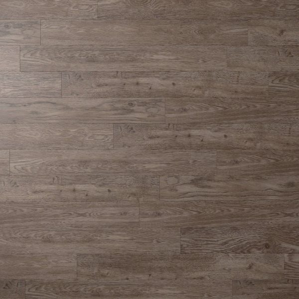 A close-up view of Foremast wood flooring, showcasing its wide brown planks with natural grain patterns and subtle color and texture variations.