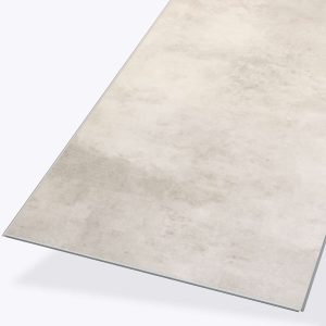 The Sicily* rug is rectangular and light beige with a subtle, cloudy texture and thin edges, displayed on a plain light gray background.