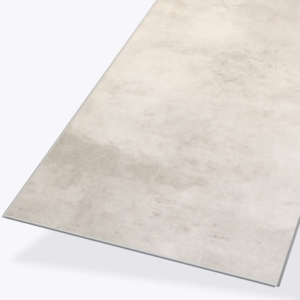 The Sicily* rug is rectangular and light beige with a subtle, cloudy texture and thin edges, displayed on a plain light gray background.