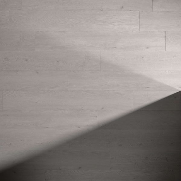 Valleggia Oak flooring in light gray features a diagonal shadow across the lower right corner, highlighting the contrast between its illuminated and shaded sections.