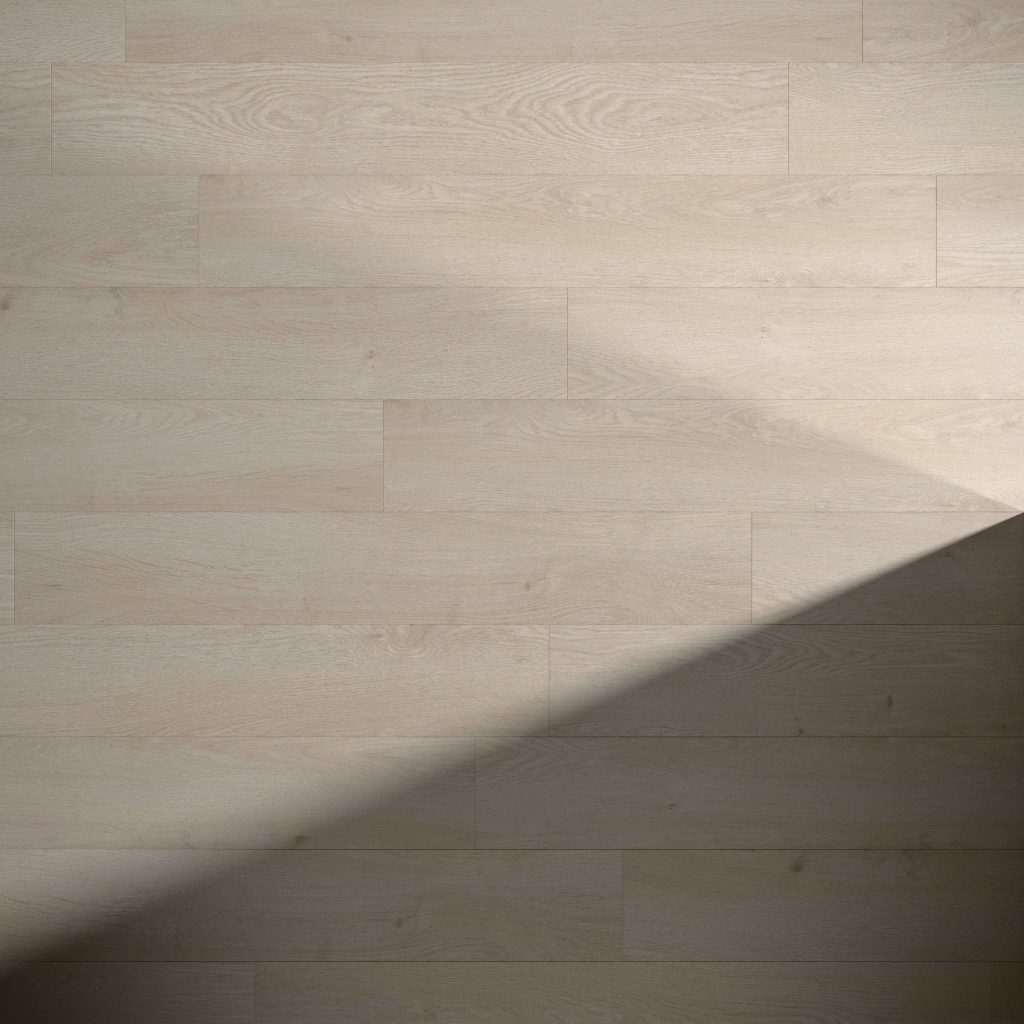 Cassis Oak flooring features narrow, light wood planks running horizontally. A diagonal shadow covers the bottom right area, highlighting the contrast between the illuminated and shaded sections.