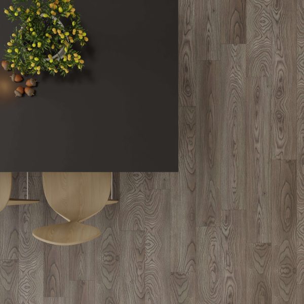 A top-down view of a dark rectangular table with a plant and small objects, two light wooden chairs, on a Toulon Oak floor featuring a gray woodgrain pattern.