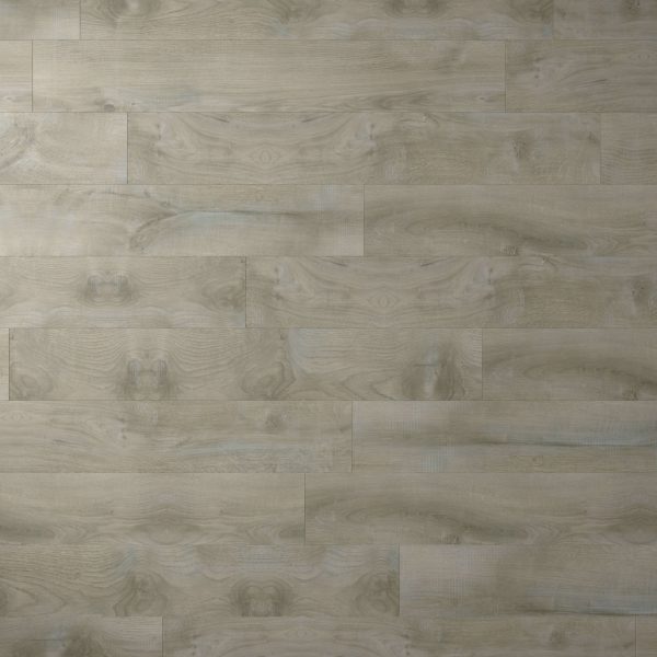 A close-up view of Monaco Oak light gray wood flooring with visible grain patterns and knots, arranged in a staggered plank design. The smooth, clean surface adds elegance to any space.