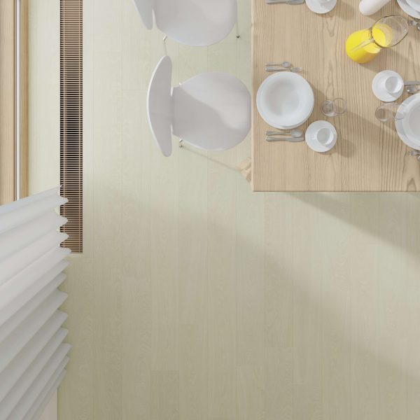 Aerial view of a Tacoma Oak dining table set for breakfast with white plates, cups, and a glass jug of orange juice, surrounded by white chairs on a matching floor near a large window with vertical blinds.