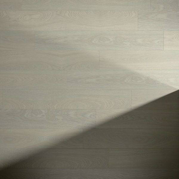 Somerville Oak flooring features light wood tones with visible grain patterns and a diagonal shadow across the bottom right, highlighting a contrast between illuminated and shaded areas.