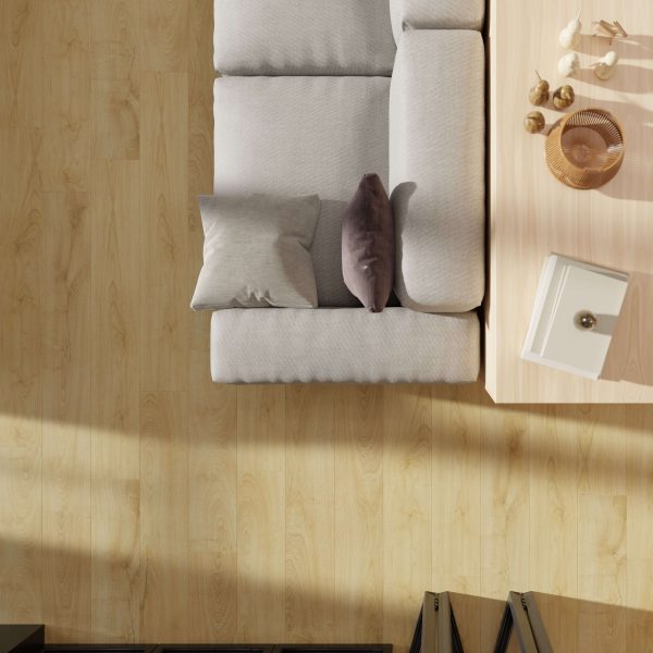 Top view of a light gray sofa with two pillows beside a light wood coffee table on Sedona Oak flooring, sunlight streaming in from the left. The table holds a small tray, vase, and bowl.