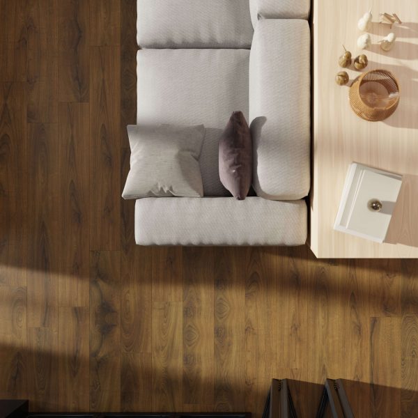 Top-down view of a light gray sofa with cushions beside a light wooden coffee table on Charlotte Oak, a medium brown wood floor.