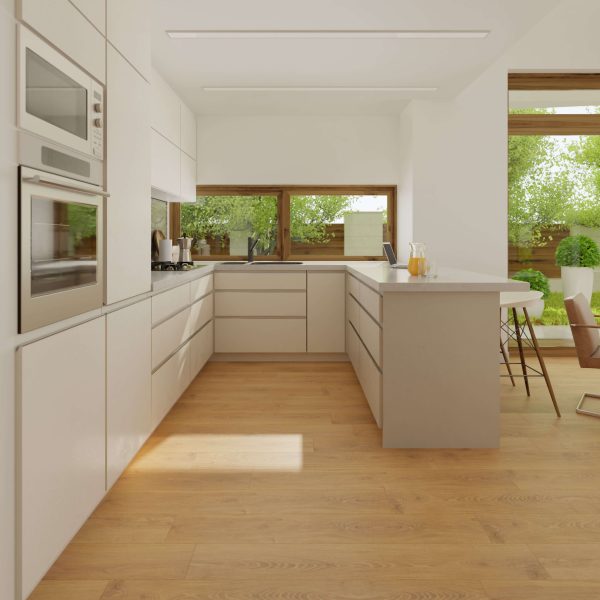 Modern kitchen featuring Alondra Oak light wood floors, white cabinets, built-in oven and microwave, a spacious island, and large windows overlooking green trees. Sunlight fills the space for a bright, airy feel.