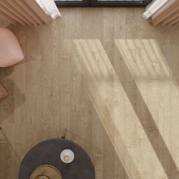 Sunlight streams across the Old Oak Matt Oiled wooden floor, casting window frame shadows. A pink chair sits near a round gray table with a small object, while beige curtains frame the windows above.