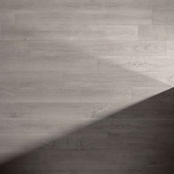 Venice Oak Grey** wood flooring with visible grain and plank seams, featuring a light gray tone. A diagonal shadow crosses the bottom right corner, highlighting the contrast between lit and shaded areas.
