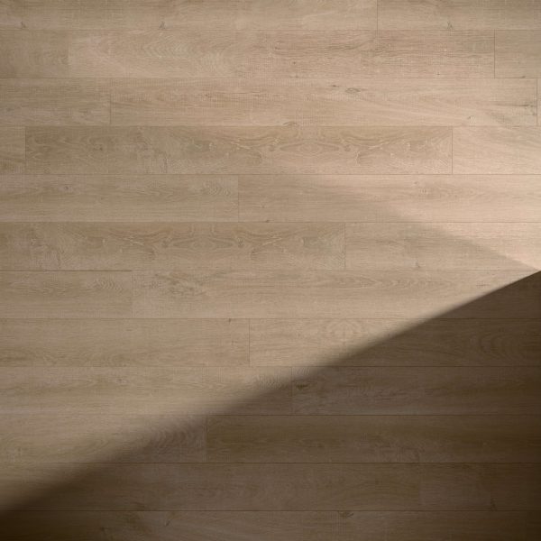Venice Oak Natural features a light brown wooden floor with visible grain patterns. A diagonal shadow crosses the lower right corner, highlighting the contrast between illuminated and shaded areas.
