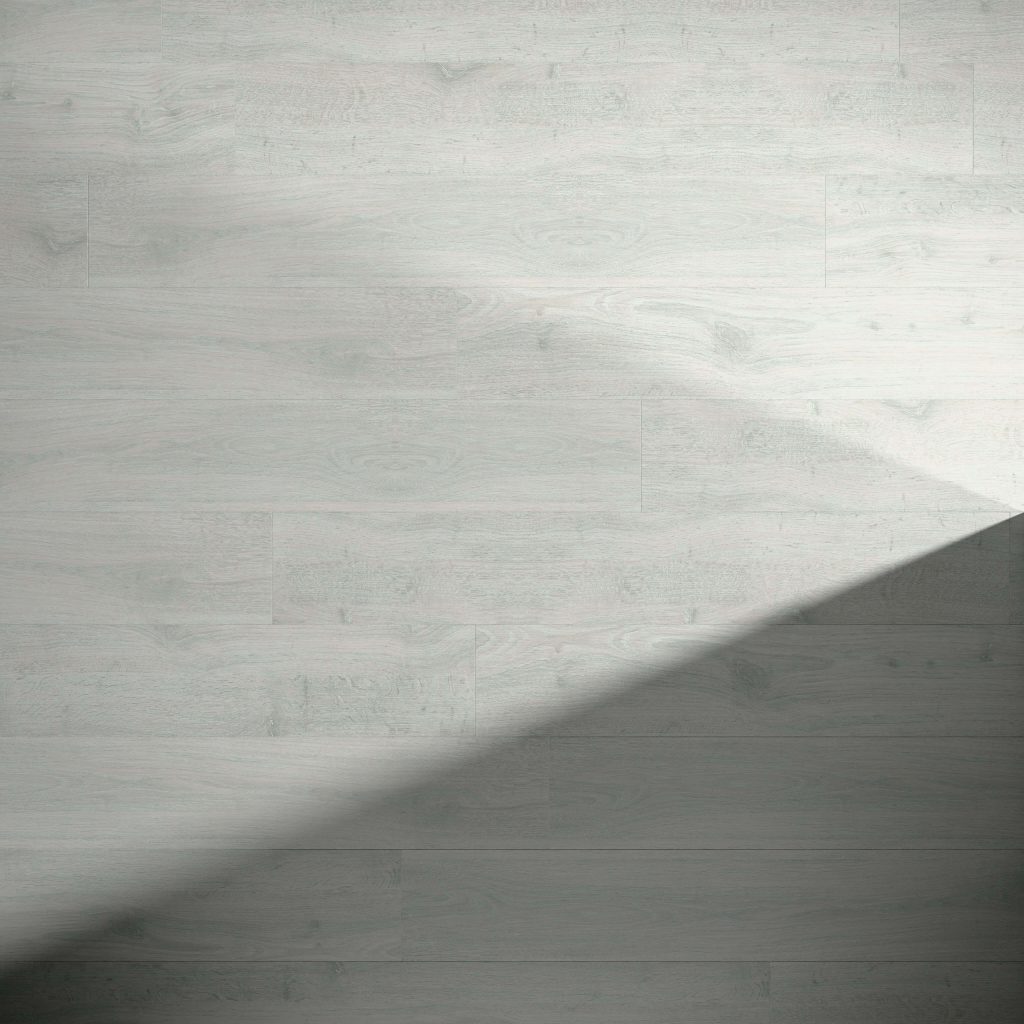 Laneffe Oak features a light gray wood floor with visible grain patterns. A diagonal shadow extends from the lower right corner to the center, highlighting a contrast between illuminated and shaded areas.
