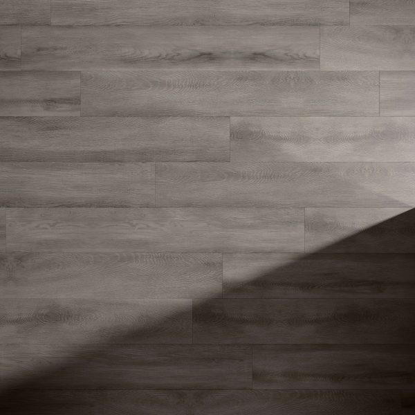Rochefort Oak wood flooring features a light gray finish in a staggered plank layout, with a sharp diagonal shadow casting contrast between the illuminated and shaded areas on the lower right corner.