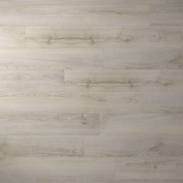 Inland* features light-colored wooden planks with subtle grain patterns and natural knots, arranged horizontally. The smooth finish and neutral tone give this flooring a modern, versatile look.