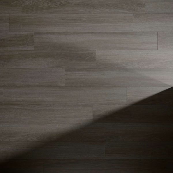 The Tollymore* features a dark wooden floor with a clear wood grain and plank pattern. A diagonal shadow crosses from the right, highlighting the contrast between the lit and shaded areas.