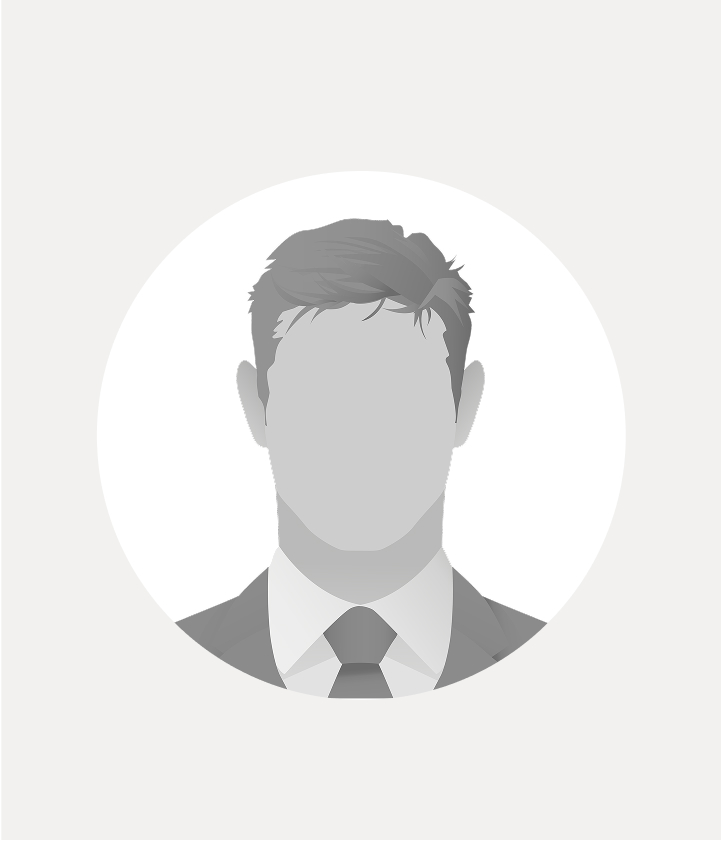 A grayscale illustration of a faceless man wearing a suit and tie, set against a plain white circular background.