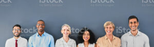 Stock photo employees standing against blue background